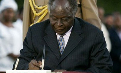 President Kibaki Signing Act